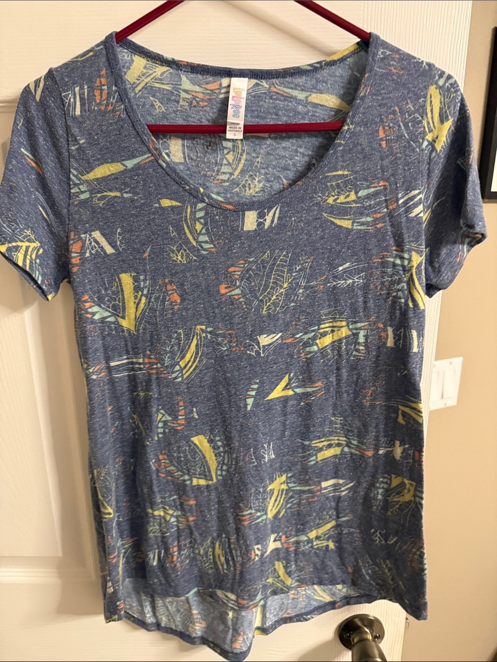 LuLaRoe Blue Scoop Neck Tee with Yellow & Orange Abstract Print